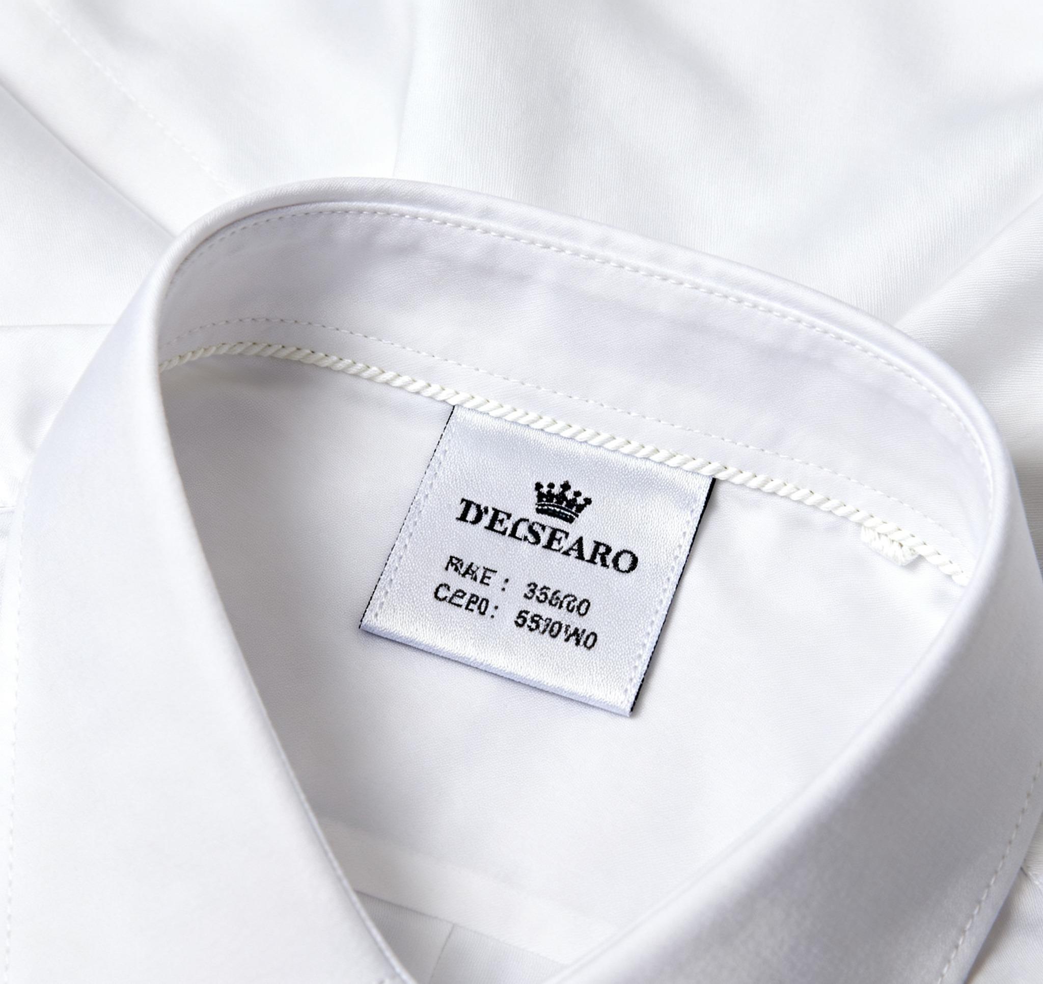Square collar label sewn neatly inside a white dress shirt.”